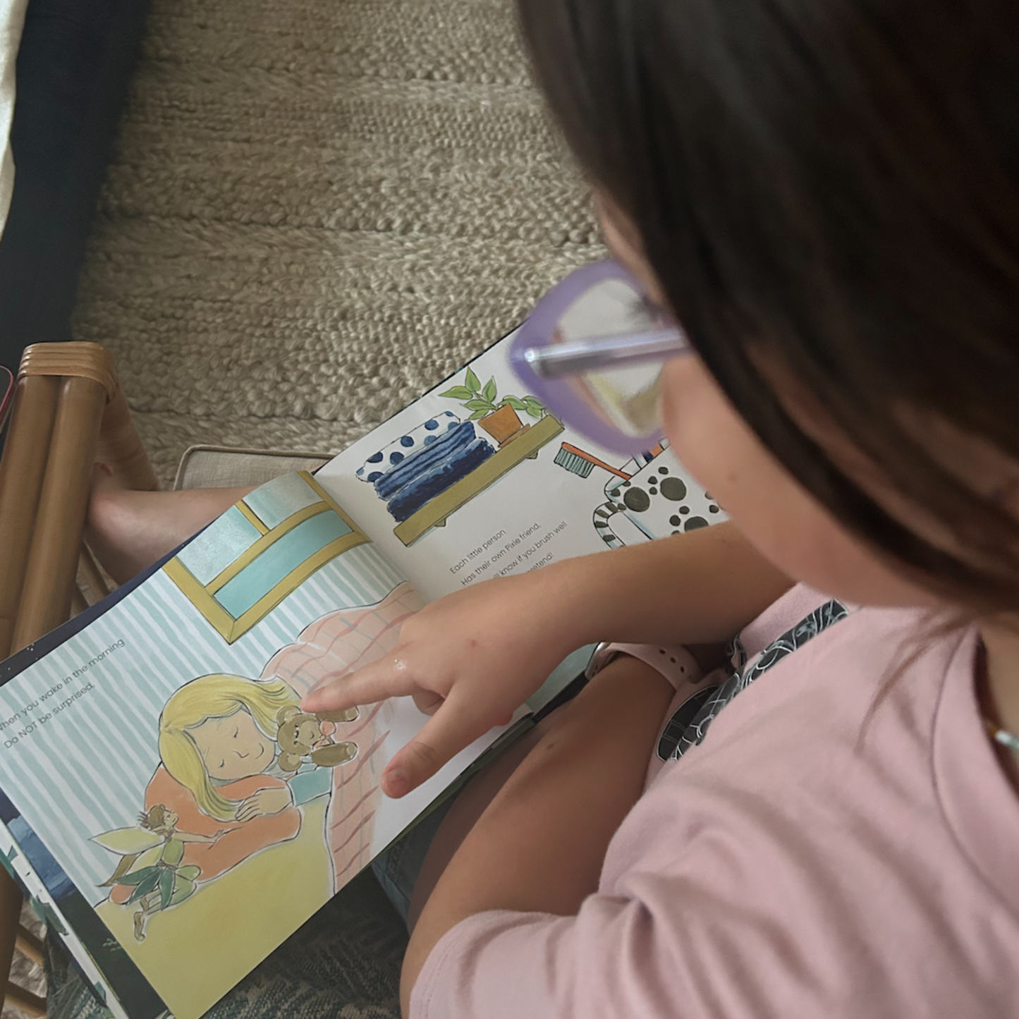 Child pointing at Tooth Pixies story book