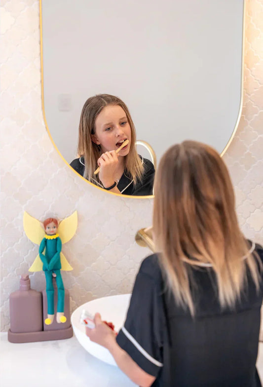Parent teaching child tooth brushing motivation for kids Australia