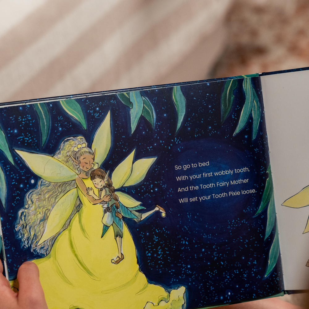 Illustration of Tooth Fairy Mother holding a Tooth Pixie in a book with a starry night background